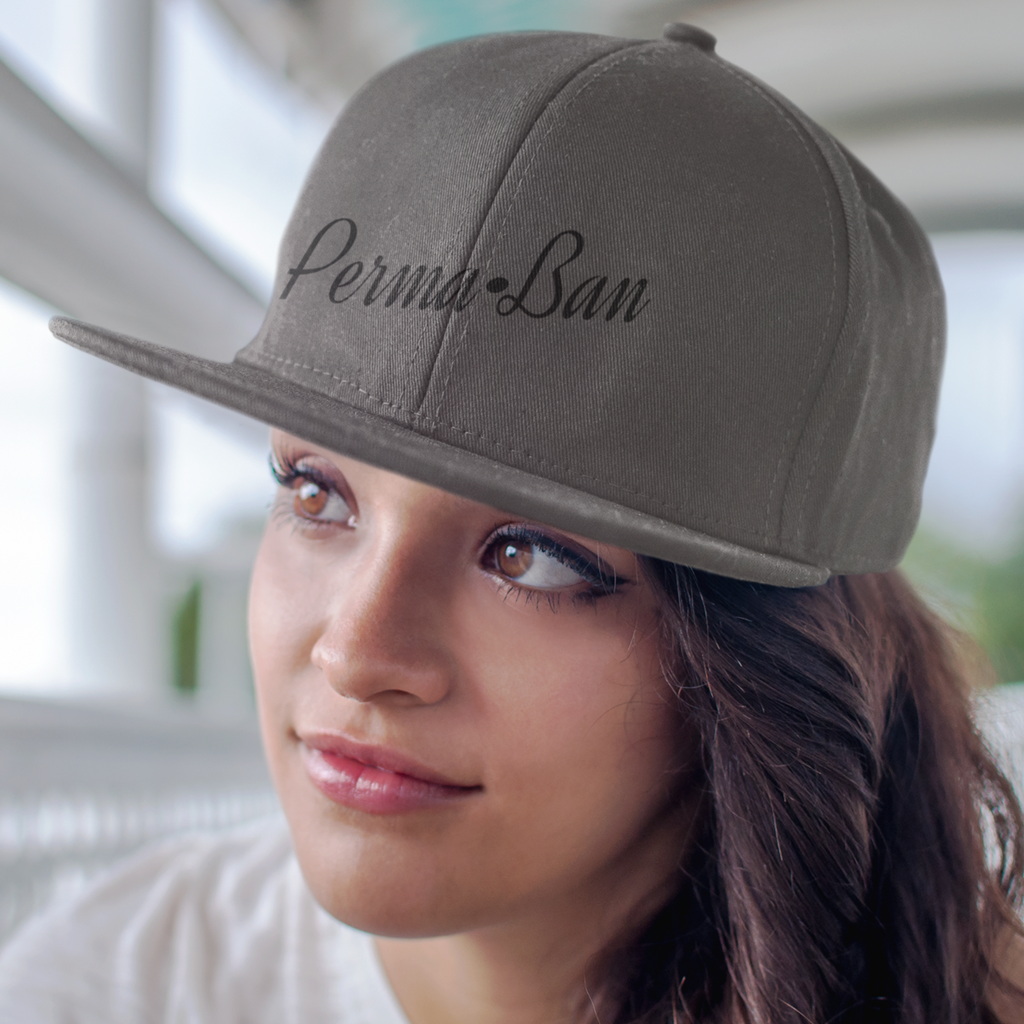 Woman wearing a grey snapback hat with the rabidm0ngoose perma-ban design