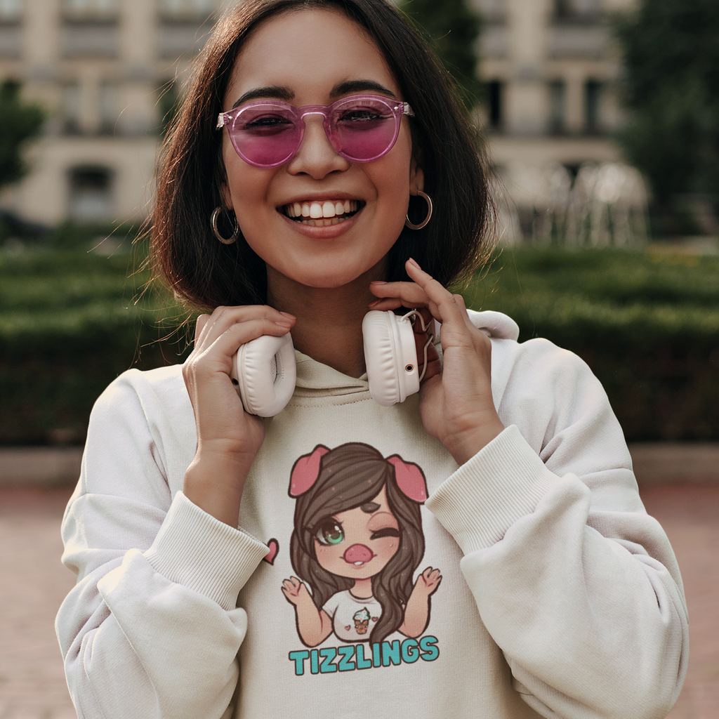 a woman with rose colored glasses and headphones wearing a white hoodie with the tizzylings design from tizzytam