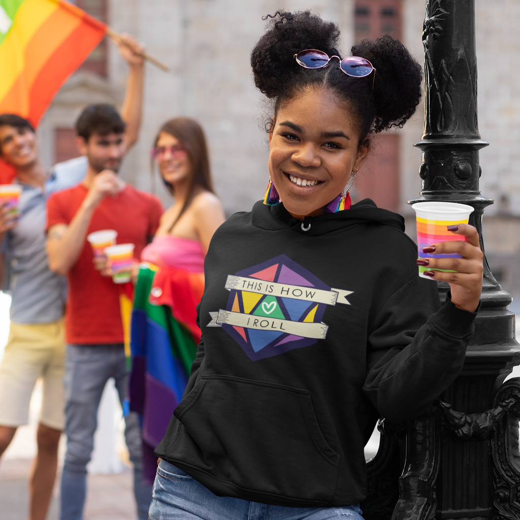 a woman at a pride parade wearing the Pride D20 design from CalyxCreative