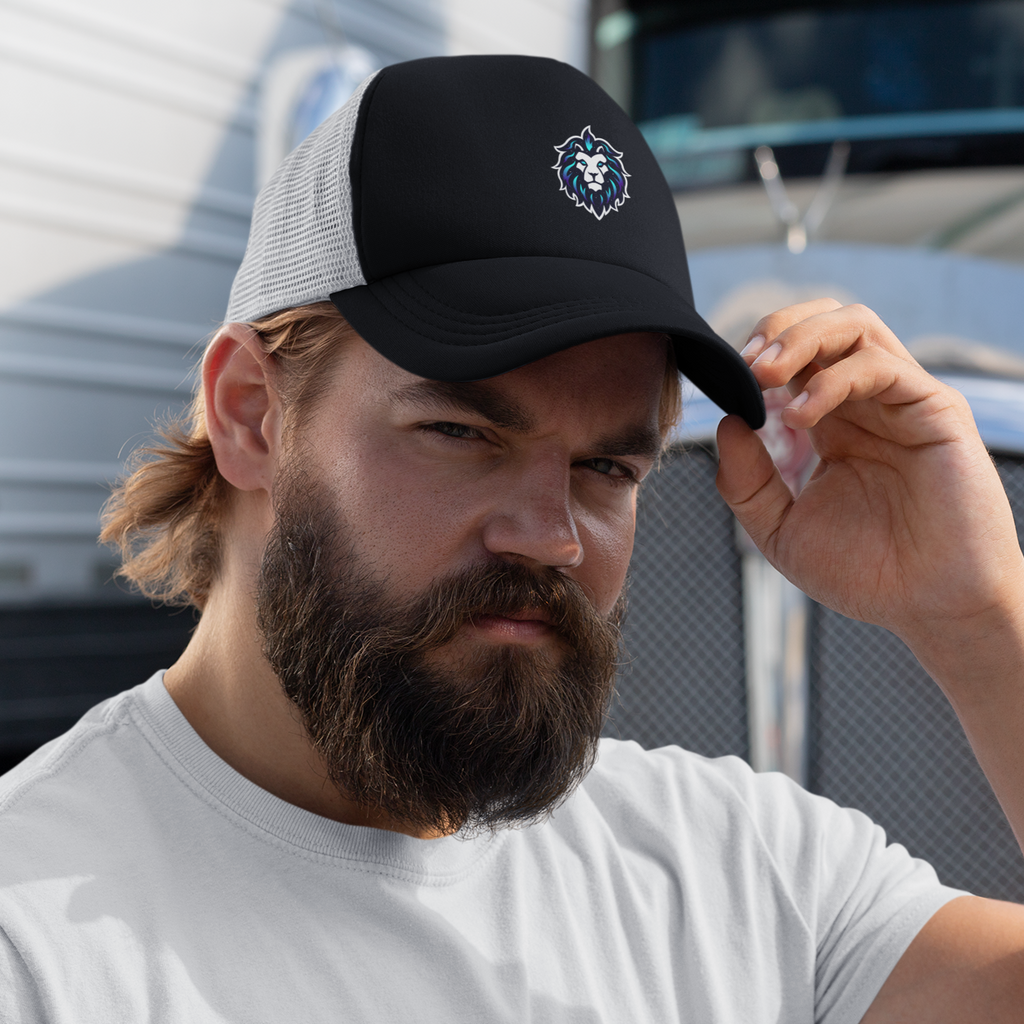 a man with a beard wearing a black and white trucker hat with the Leo emblem from Sandromeda