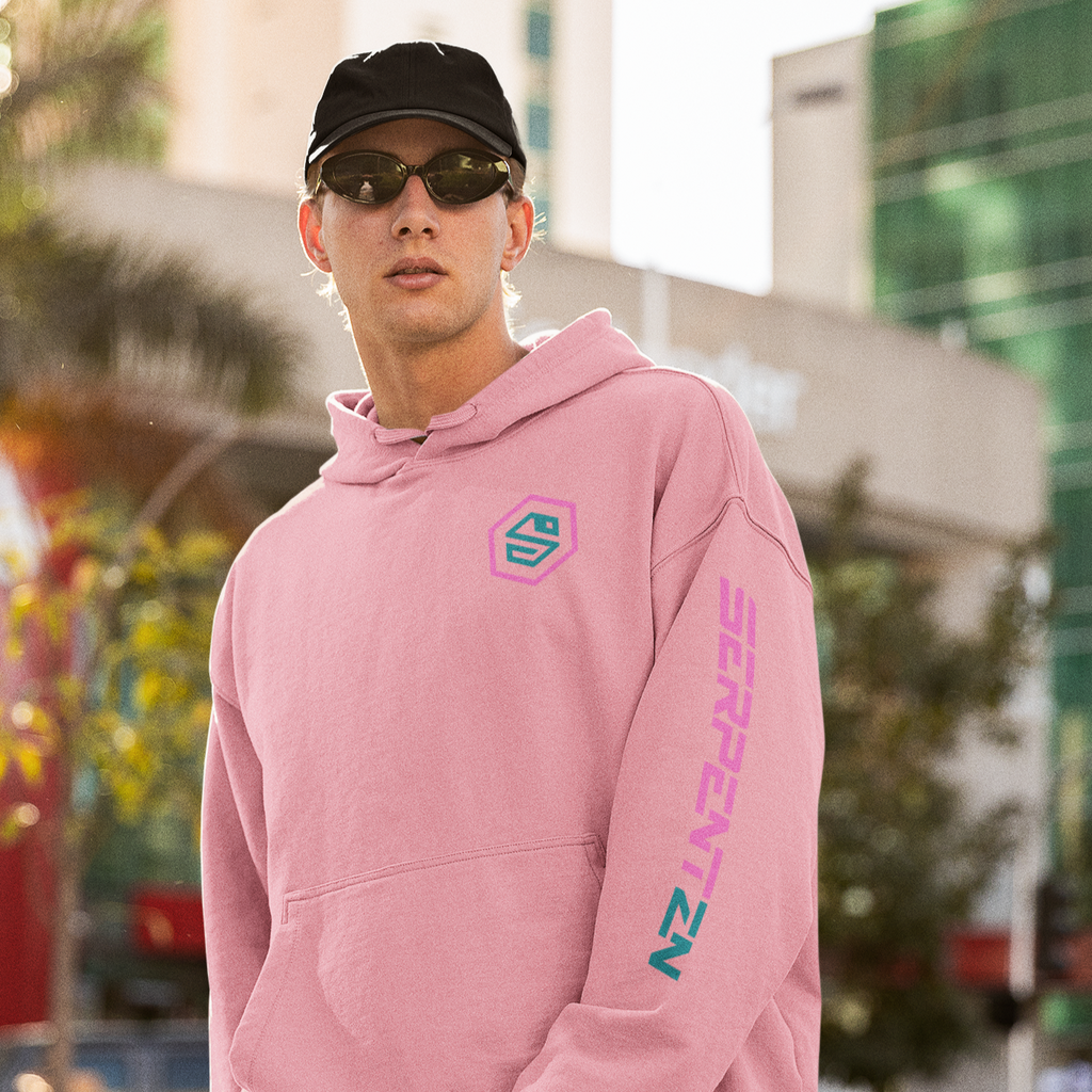 a man wearing a baseball hat, sunglasses, and a pink hoodie with the serpentenz logo on the chest and the serpentnz wordmark down the left sleeve