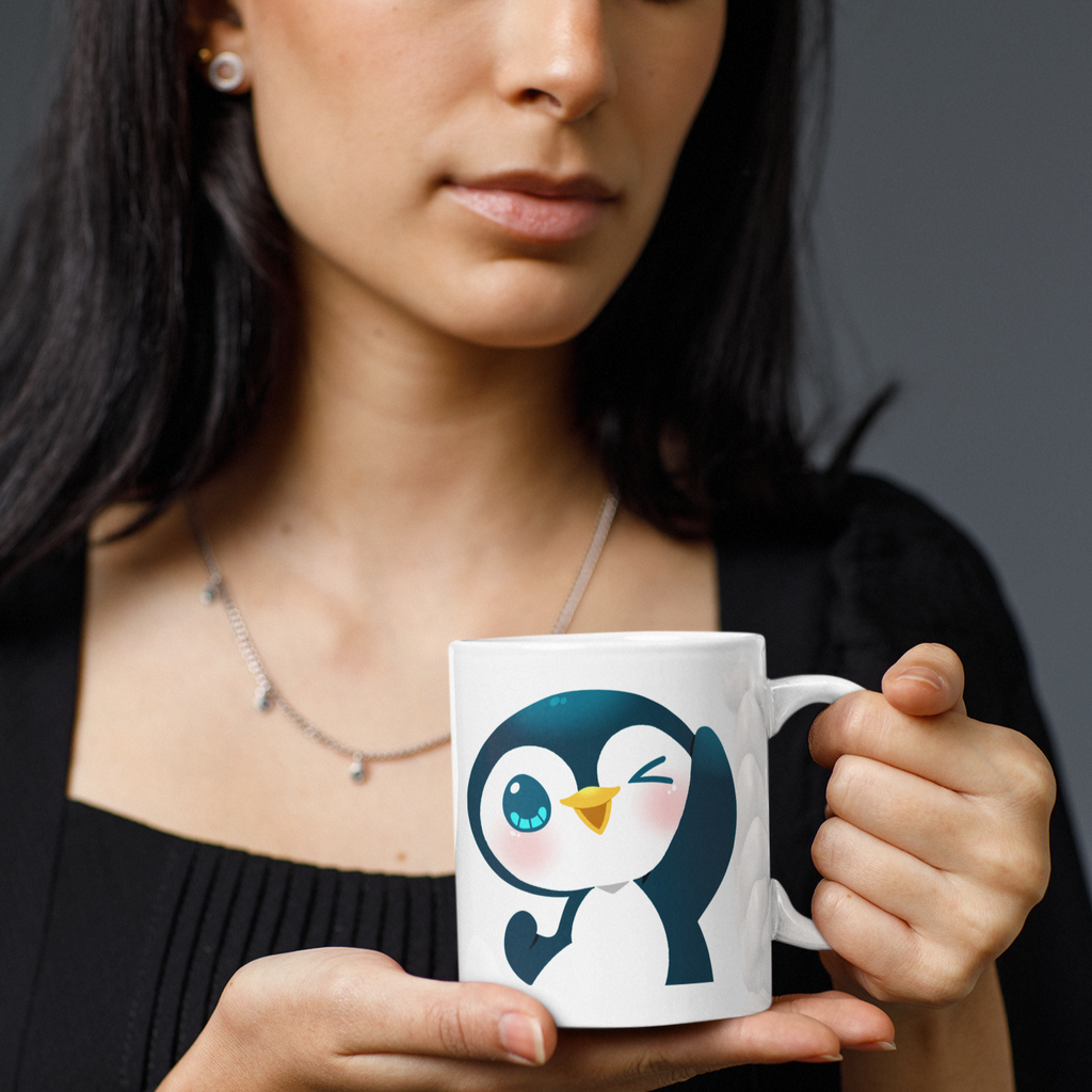 a woman with dark hair holding a white mug with the happyf333tz penguin