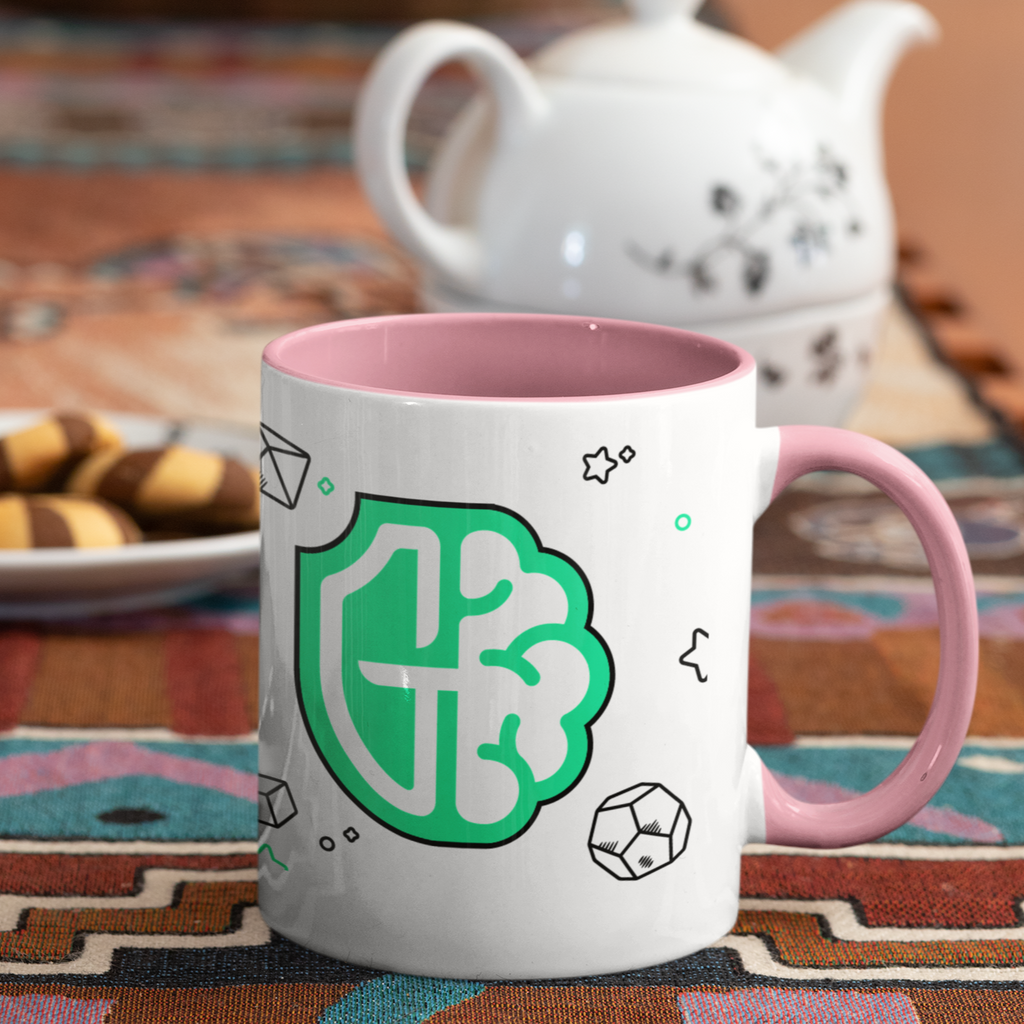a mug with a pink rim and pink handle and the gamer mental health design from Guardians MH