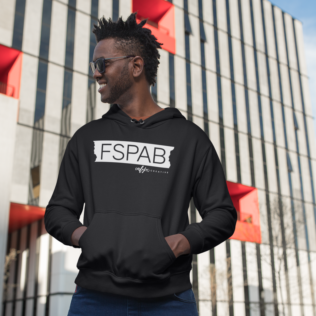 black male model wearing the black FSPAB hoodie standing in front of a white building