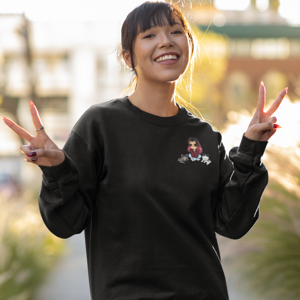 Woman wearing black crewneck sweatshirt with Meggs Cats design
