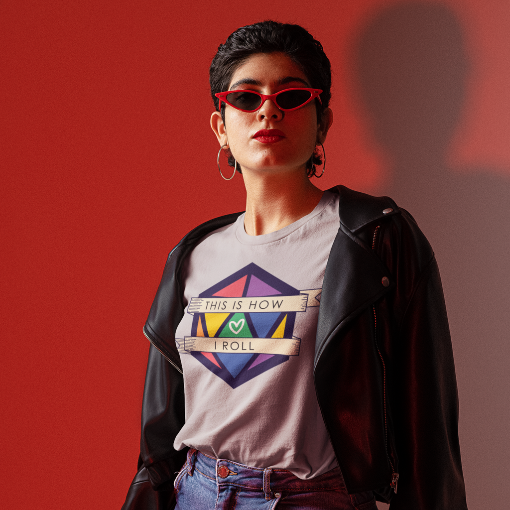 a woman wearing a leather jacket and an athletic heather pride D20 tshirt from CalyxCreative