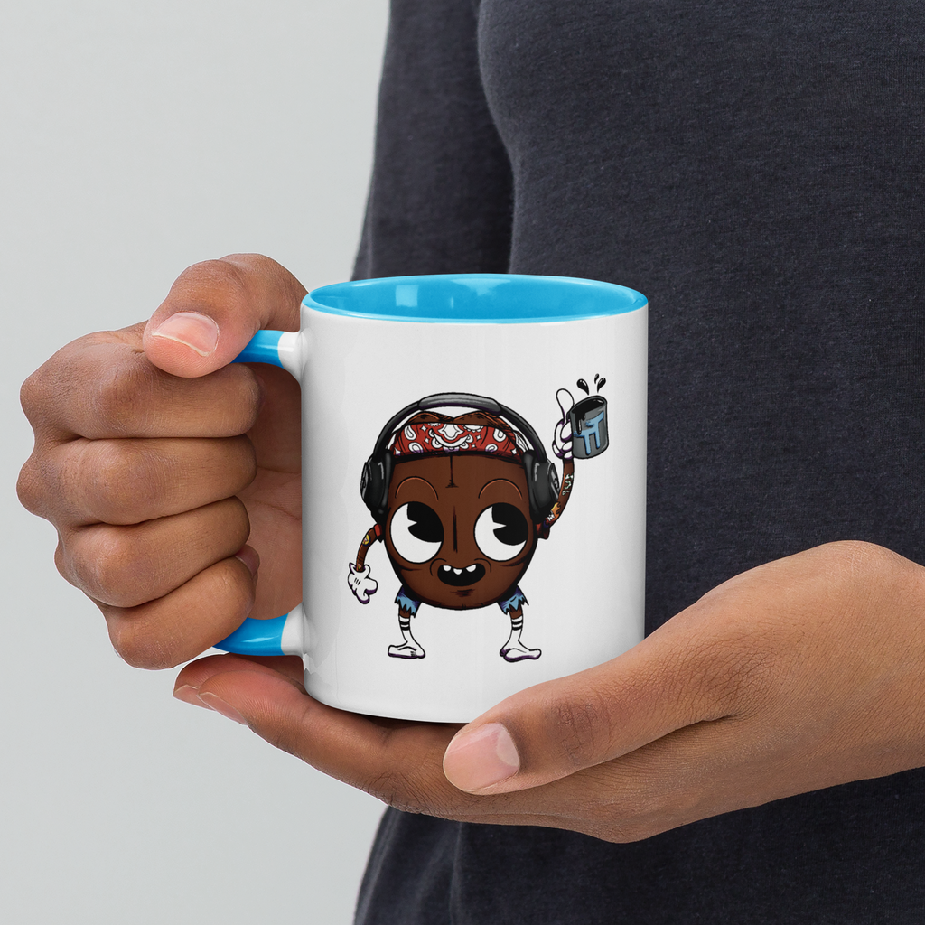 Person holding blue/white mug with Bean Boy design