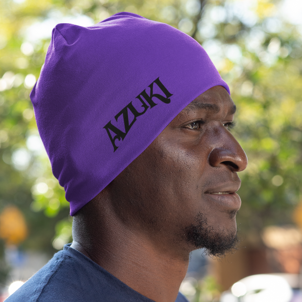 Man wearing purple reversible beanie with Curly Azuki design