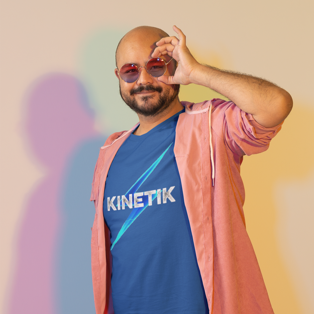 a man wearing sunglasses in a studio wearing a true royal tshirt with the kinetik logo from Forward Progress