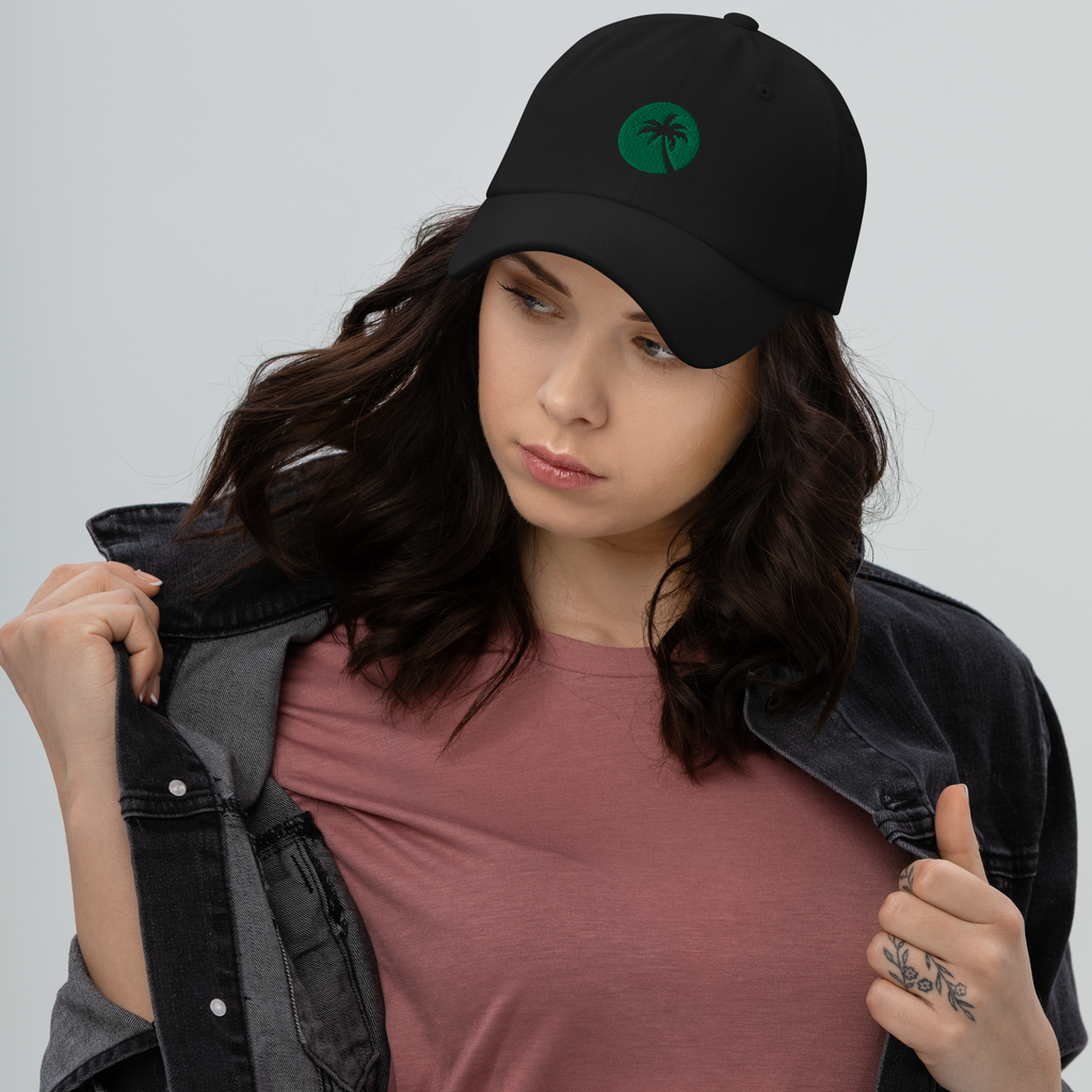 Woman wearing black dad hat with Palm design