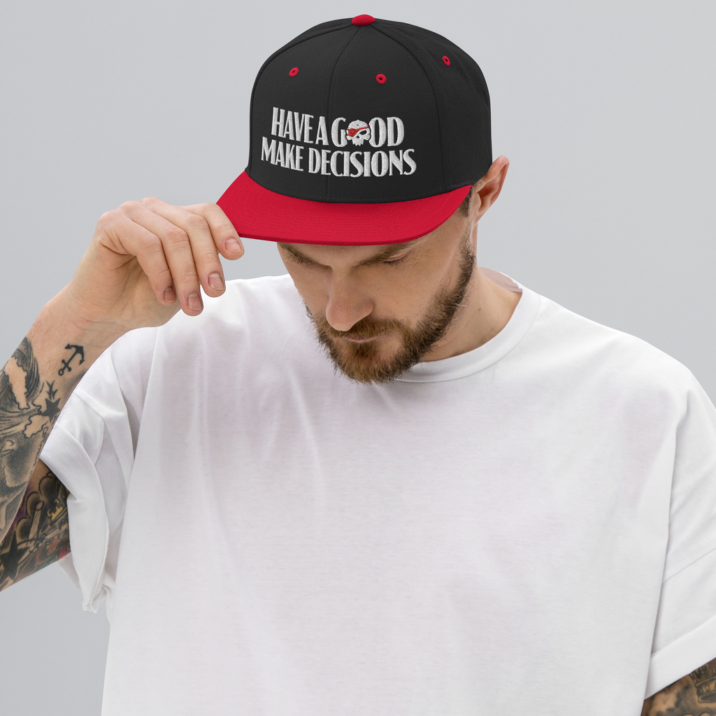 Man wearing red and black snapback with Have a Good design