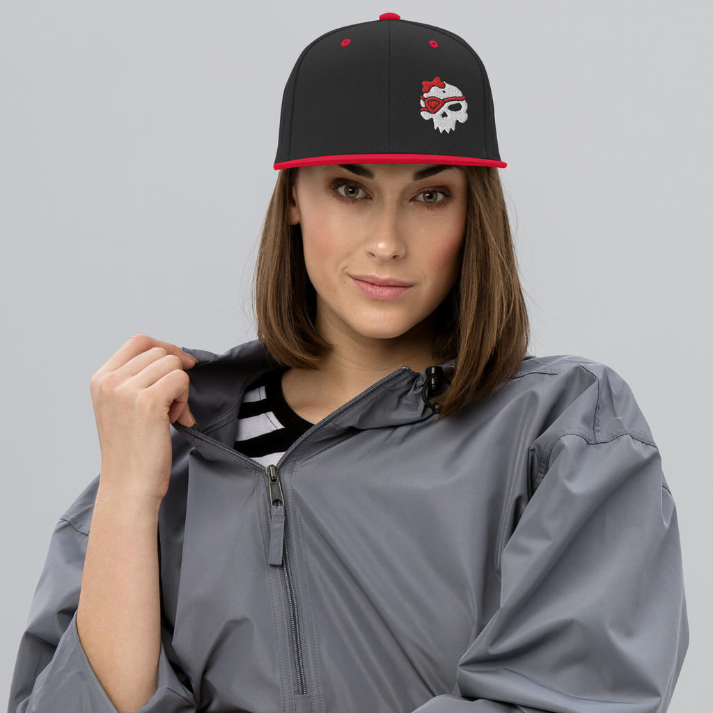 Woman wearing black/red snapback with Mrs Kro design