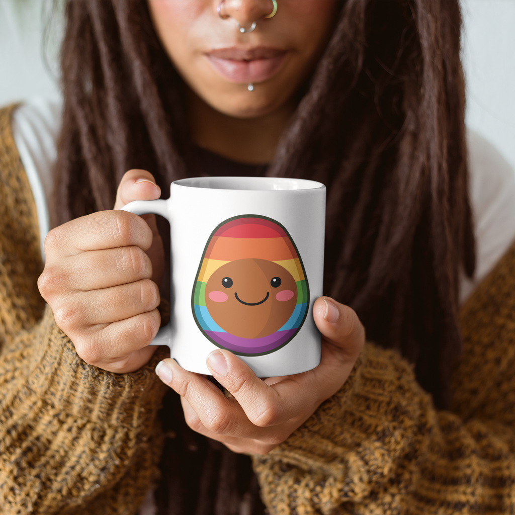 woman with dreadlocks holding a white coffee mug with the pride pascal design.