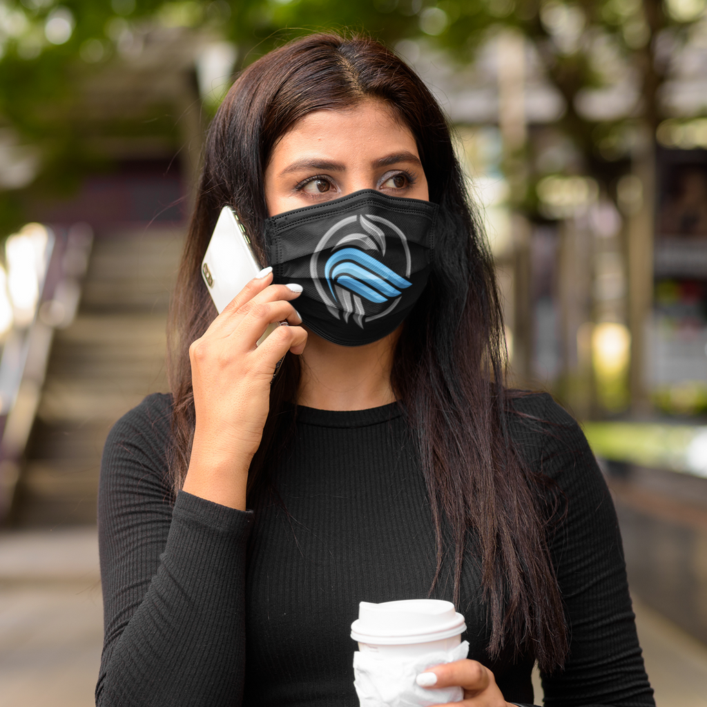 A woman talking on the phone wearing a black face mask with the sparrow coin design from aBlackSparrow.