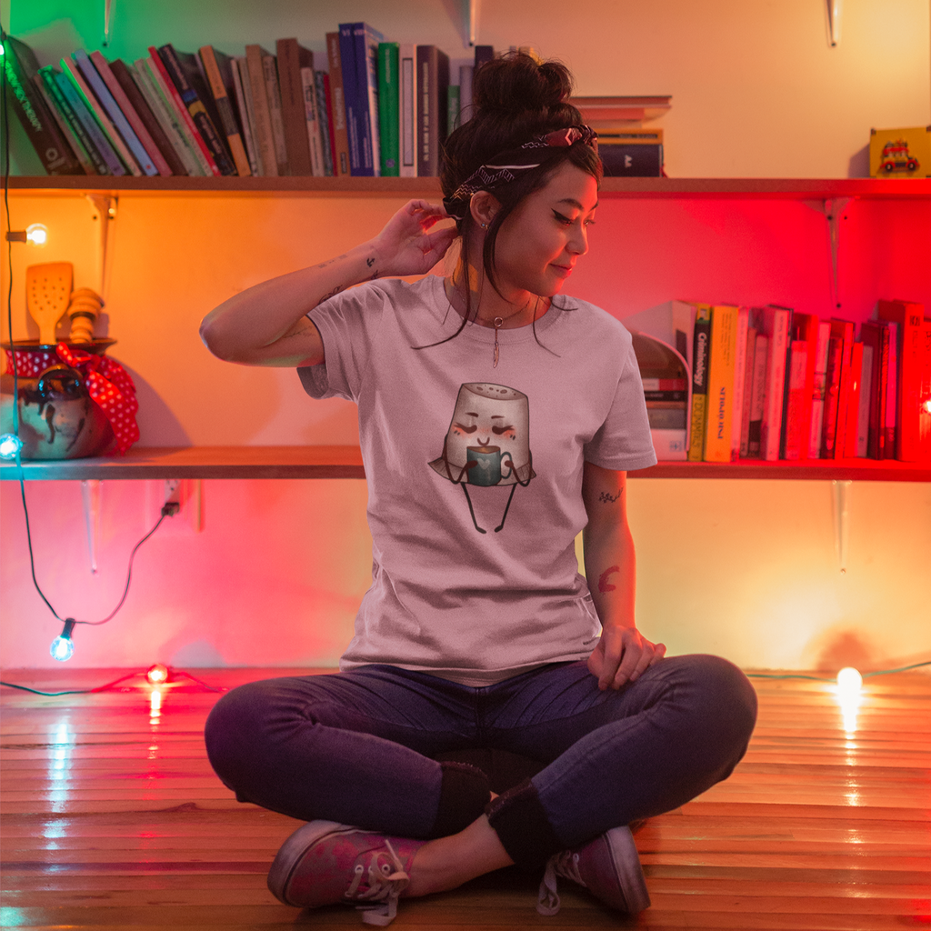 woman sitting on the floor wearing a heather prism lilac tshirt with the brooklynne michelle thimble coffee design