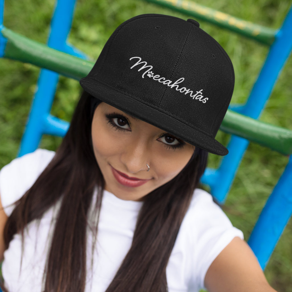 Woman wearing black snapback hat with Moecahontas wordmark