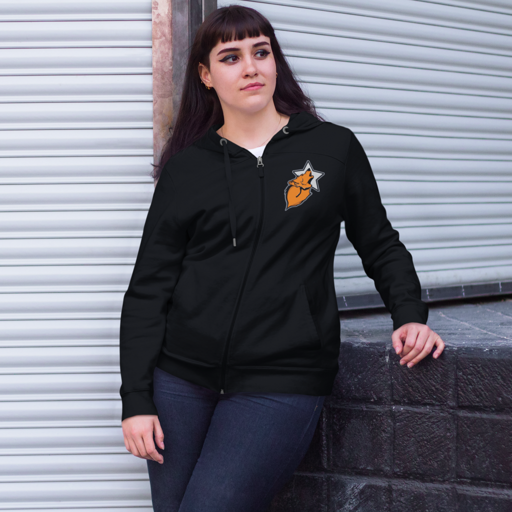 Woman leaning against brick wall wearing a black hoodie with the WolfStar76 logo on the chest.