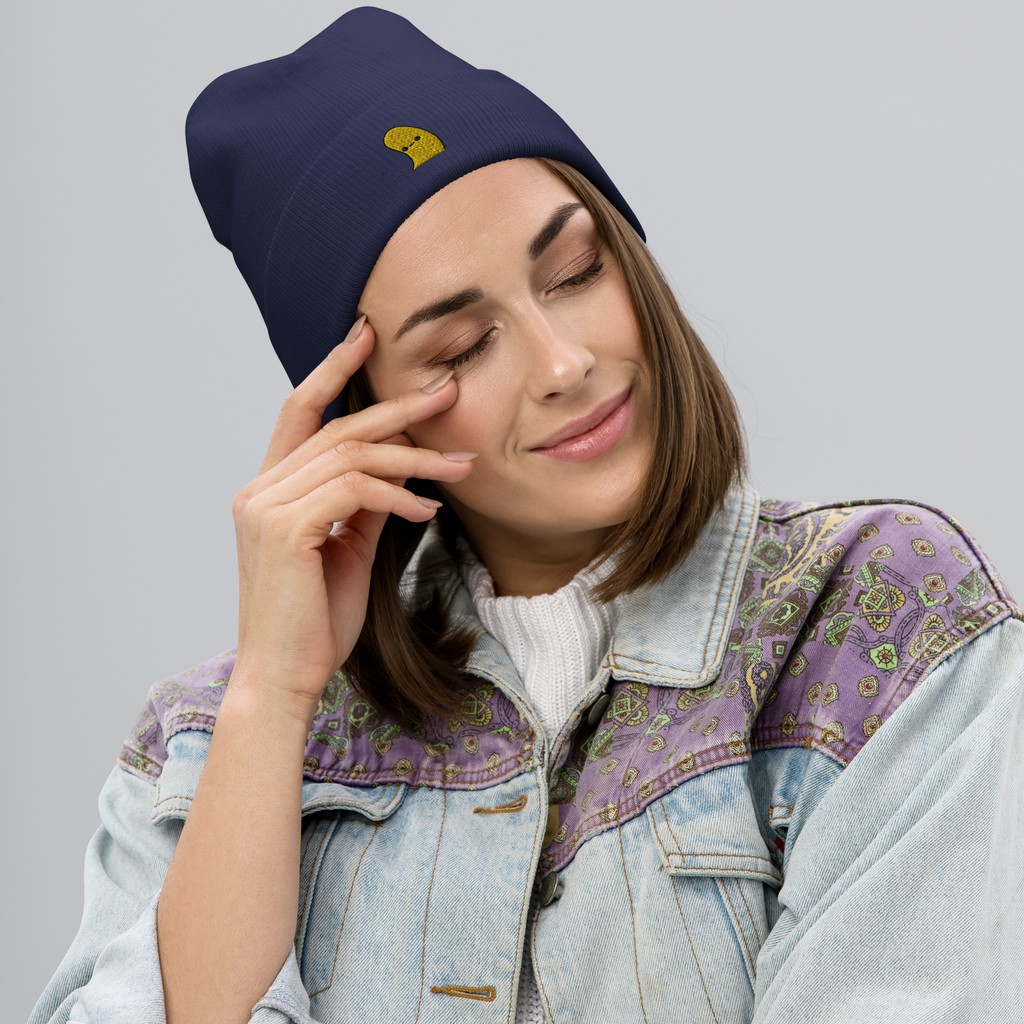 Woman wearing navy beanie with Banana Pops design