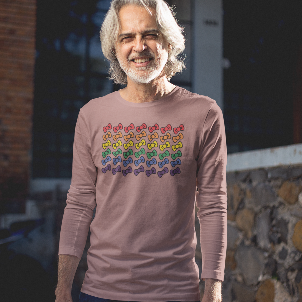 man with long white hair wearing a mauve long sleeve tshirt with the megggg rainbows design