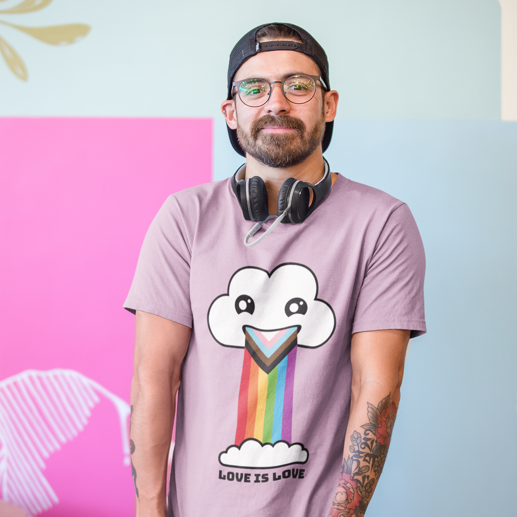 man wearing a trucker hat with headphones around his neck, wearing a lilac shirt with the love is love progressive pride cloud design.