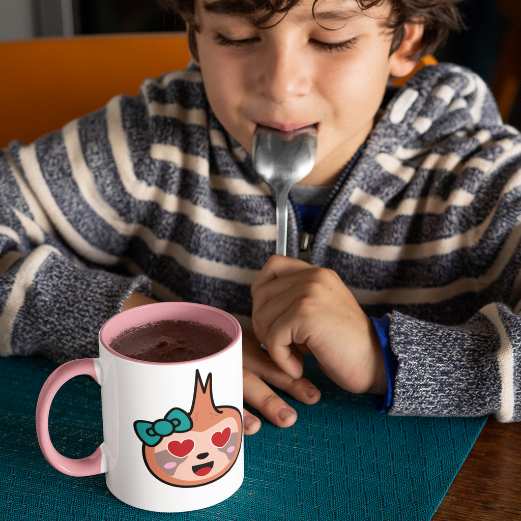 boy looking at a pink megggg fred heart eyes mug with hot chocolate in it