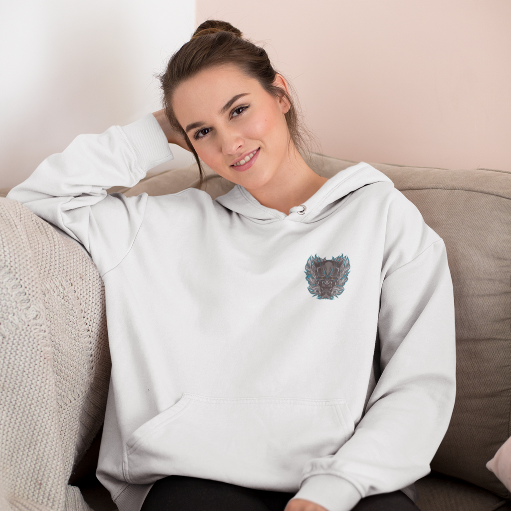 a woman sitting on a couch wearing a white hoodie with the dark oni design from TwoTapTroop
