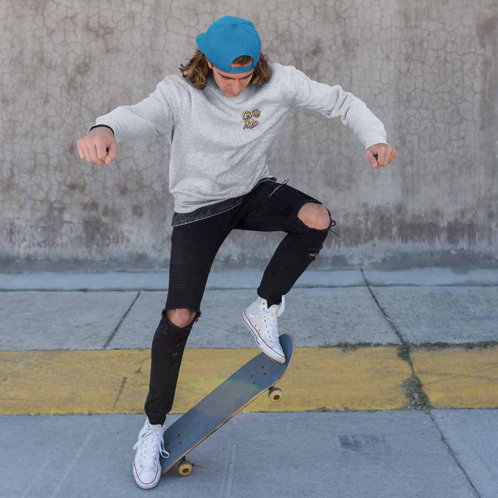 a man on a skateboard wearing a black crewneck sweatshirt with the carpe yolo design from kevin saxby