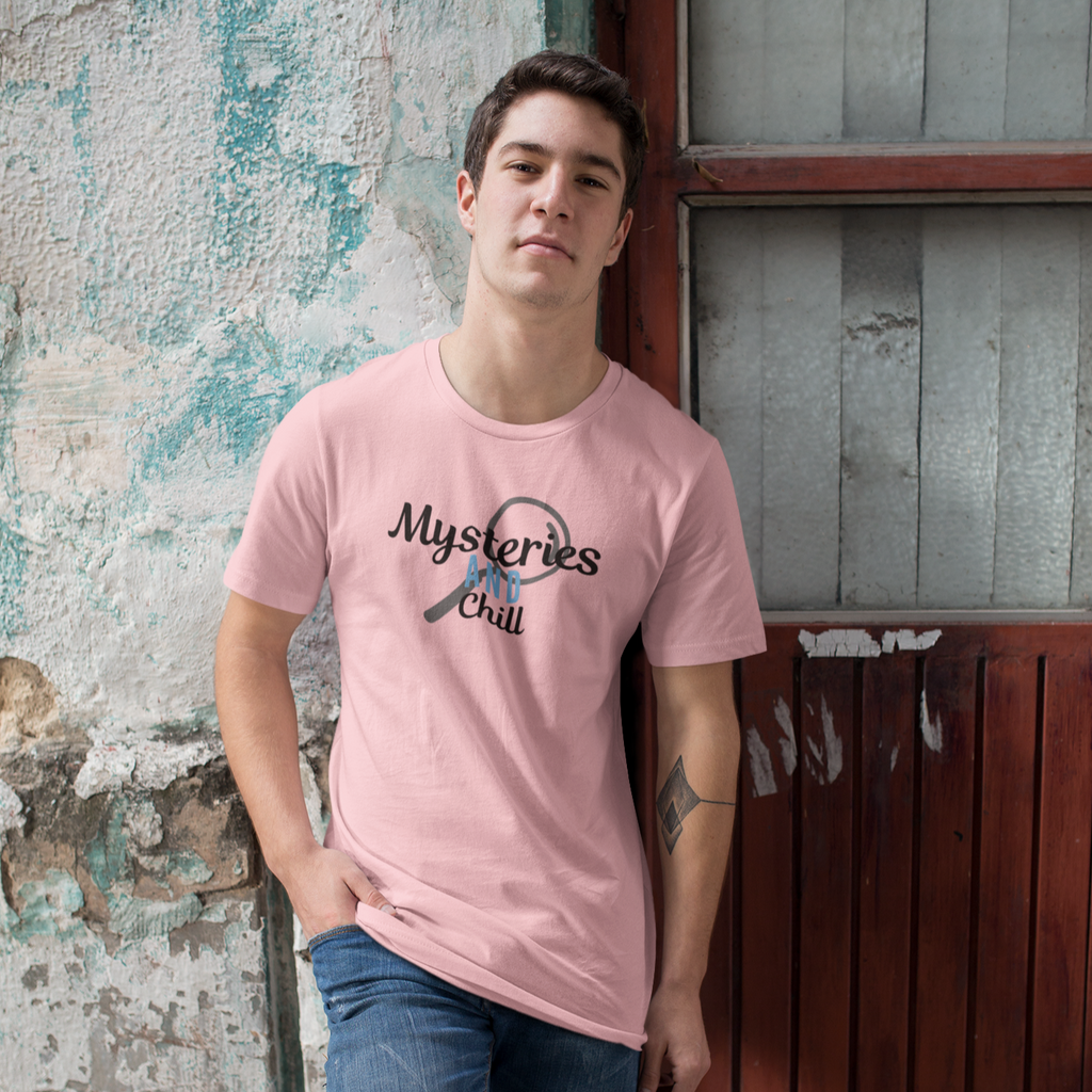 a man leaning against a brick wall wearing a pink mysteries and chill tshirt from aBlackSparrow