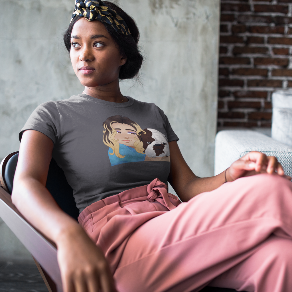 woman sitting in a chair wearing a grey tshirt with the ron and jeb design on it