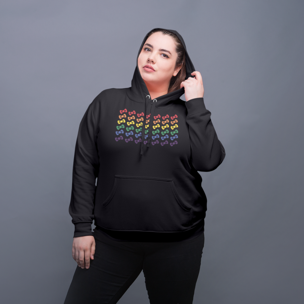 woman wearing a black hoodie with the megggg rainbow design