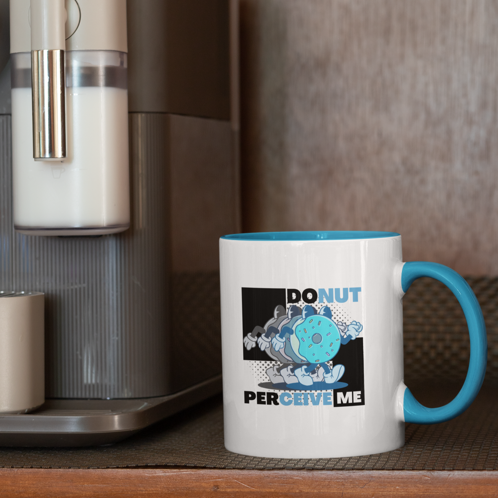 a mug with blue handle and rim with the Donut Perceive Me design from aBlackSparrow