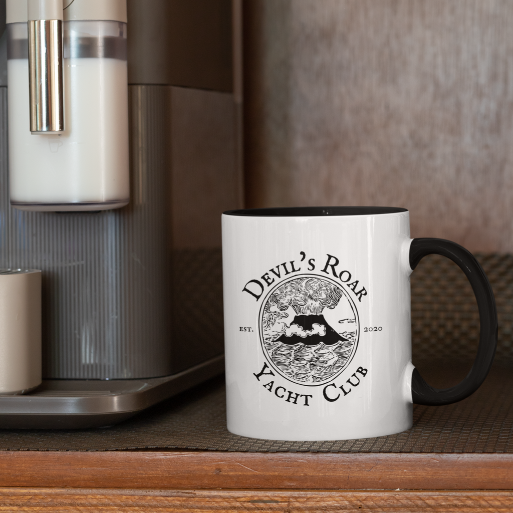 A mug with black handle and black inside with the Devil's Roar Yacht Club design from Capt_Marc.