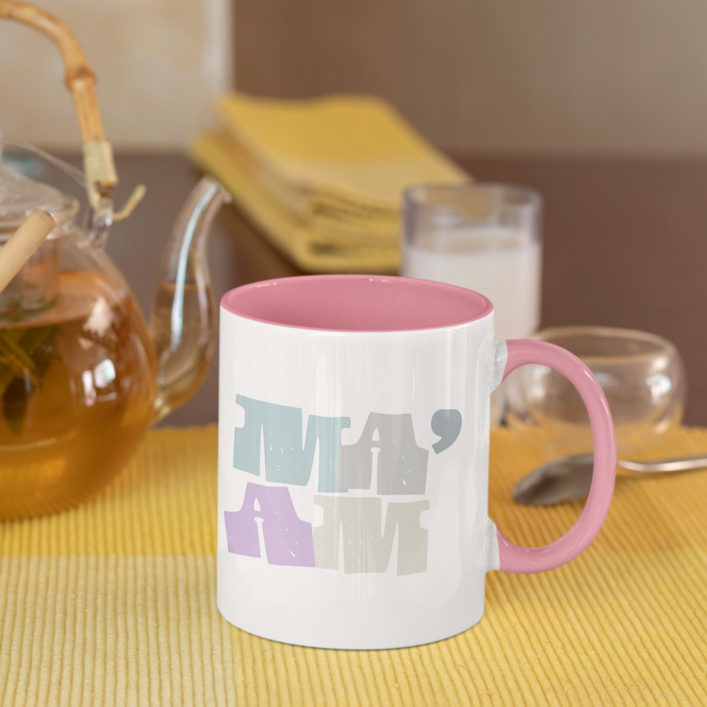 a mug with a pink handle and rim with the Ma'am design from thezacharymike