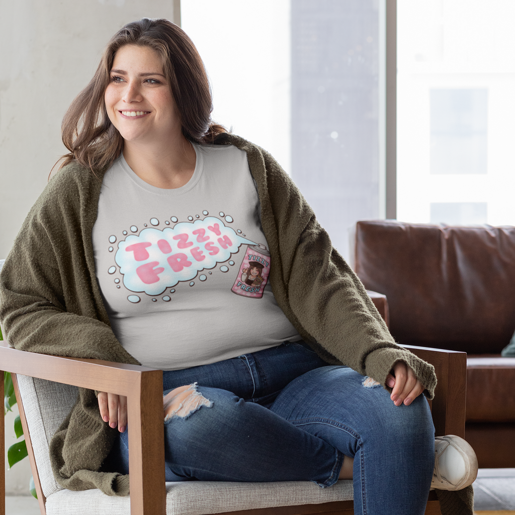a woman sitting in a chair wearing an athletic heather tshirt with the tizzy fresh design from TizzyTam