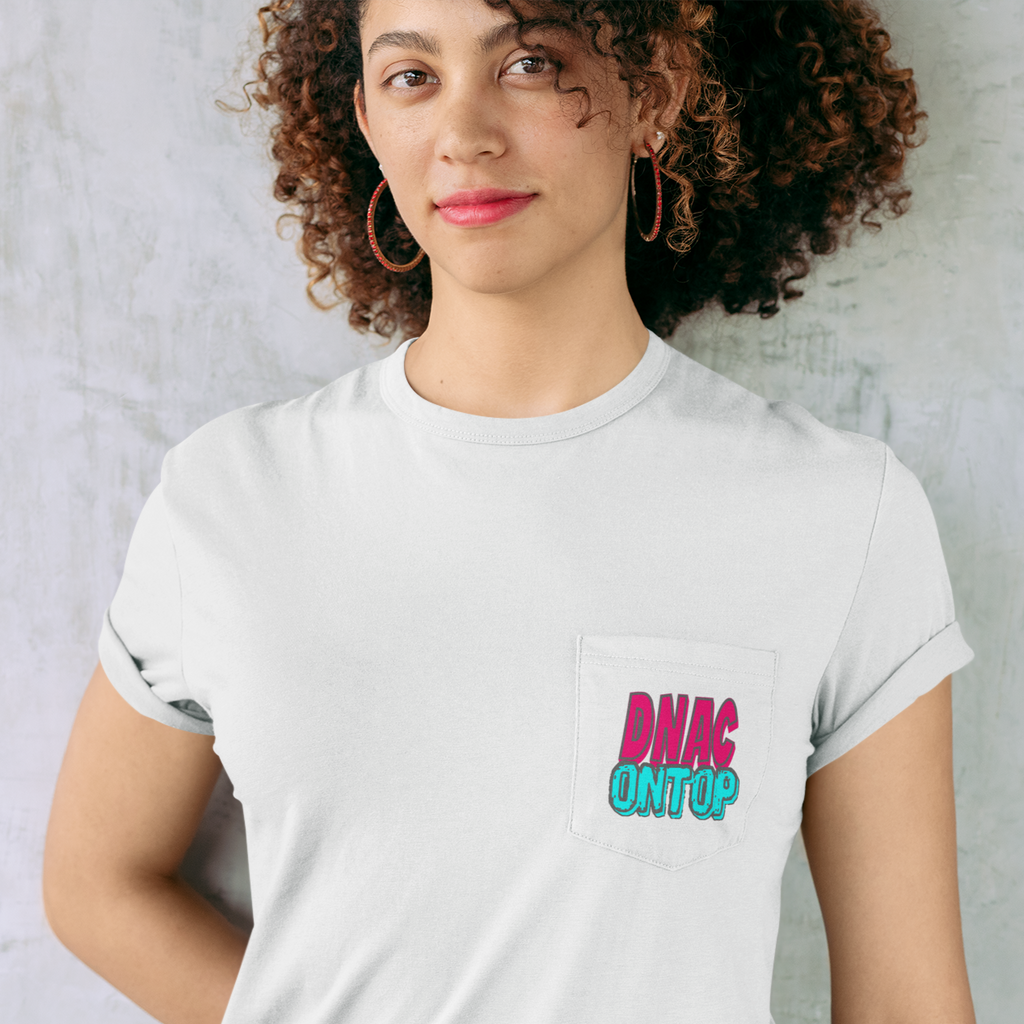 a woman standing against a wall wearing a white pocket tshirt with the DNAC On Top design from Mother0fChickens