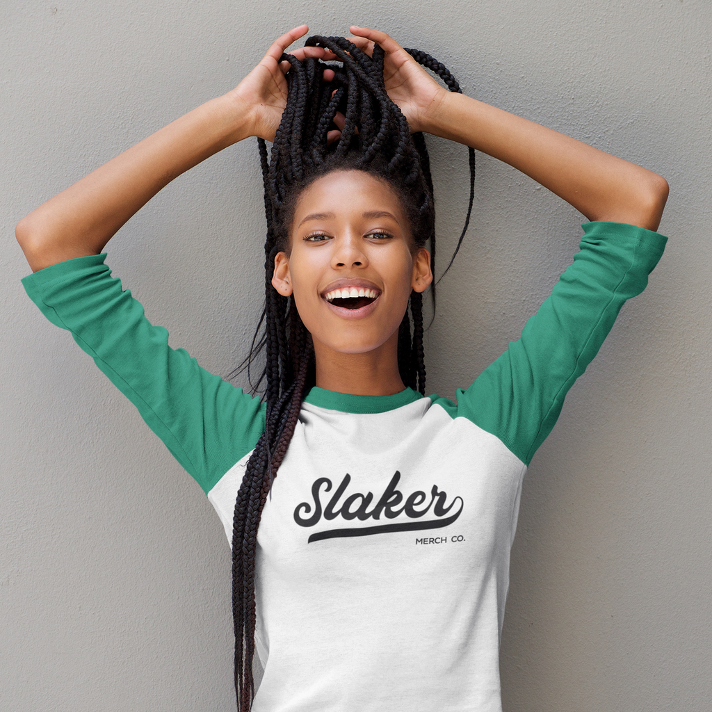 woman playing with her hair wearing a 3/4 sleeve tshirt with the slaker logo in black and white