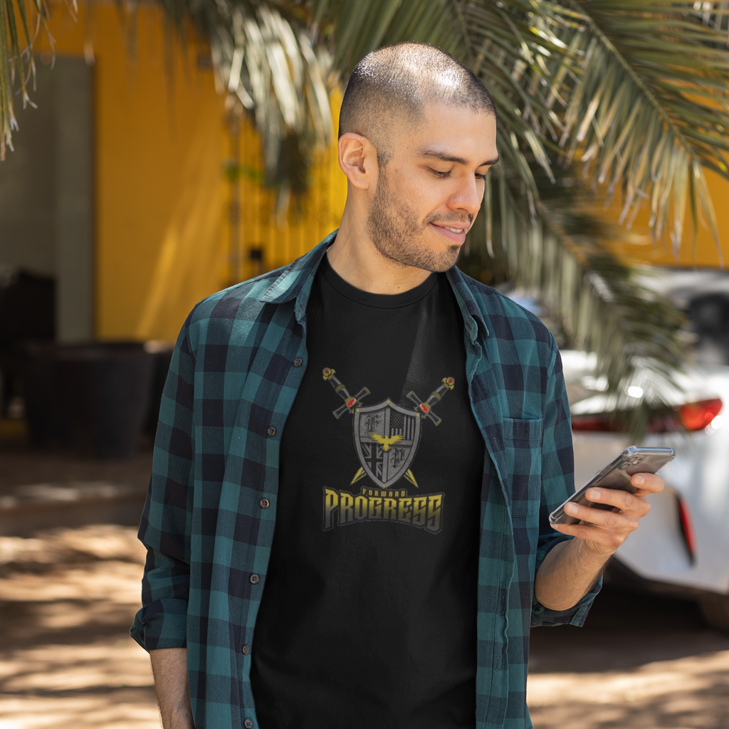 a man looking at his phone wearing a black t-shirt with the forward progress logo