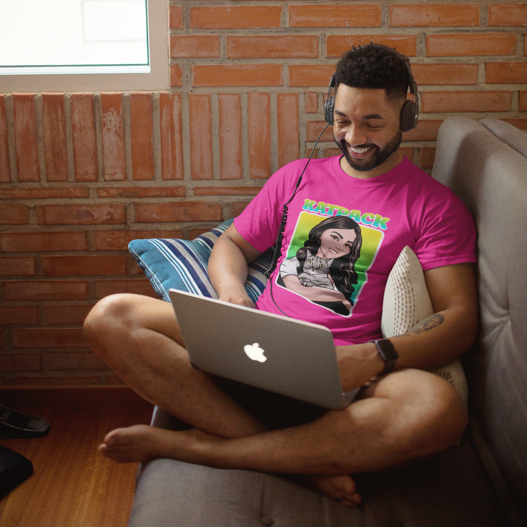 Man using laptop and wearing pink short-sleeve t-shirt with KatPack Headshot design