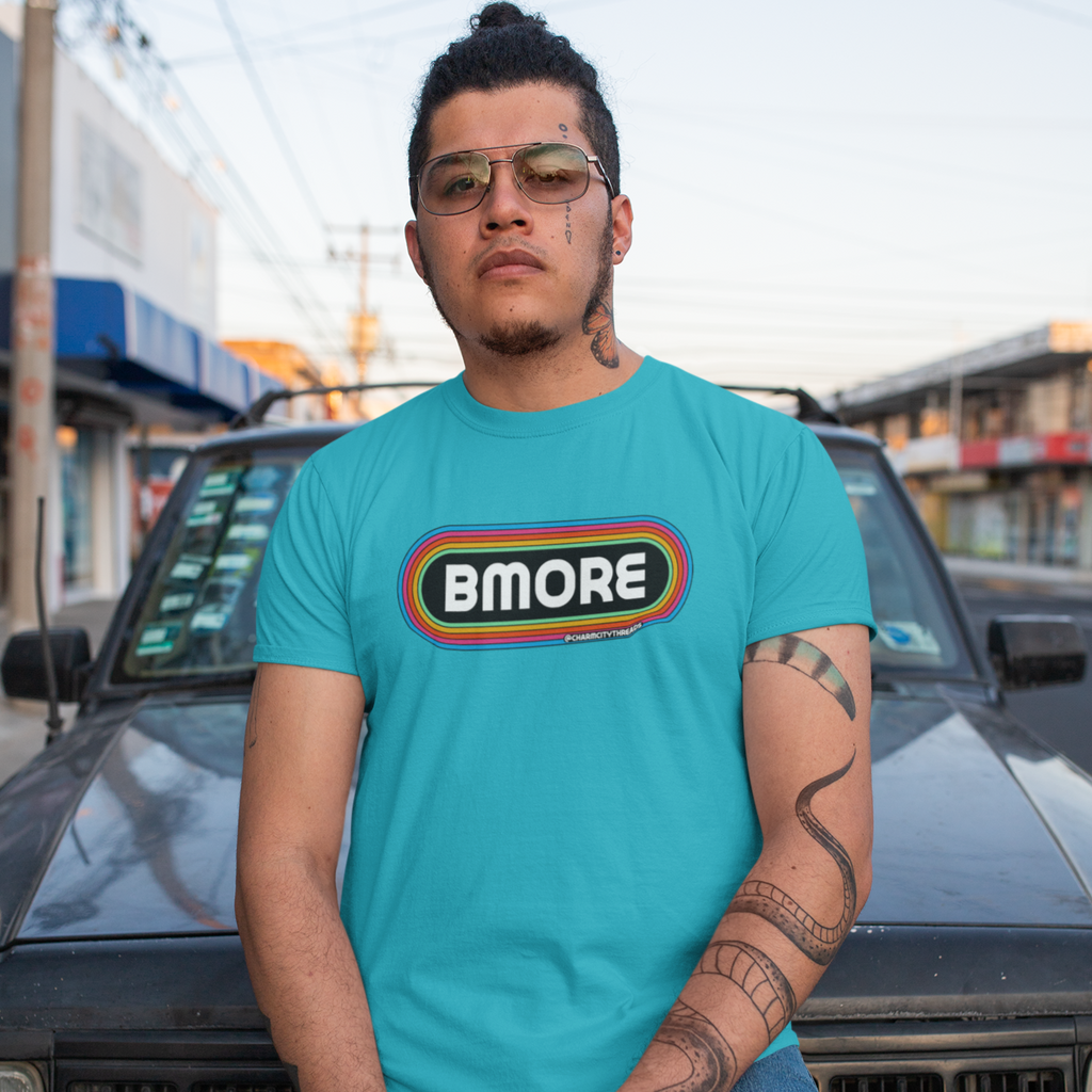 Man posed wearing t-shirt with retro BMORE design