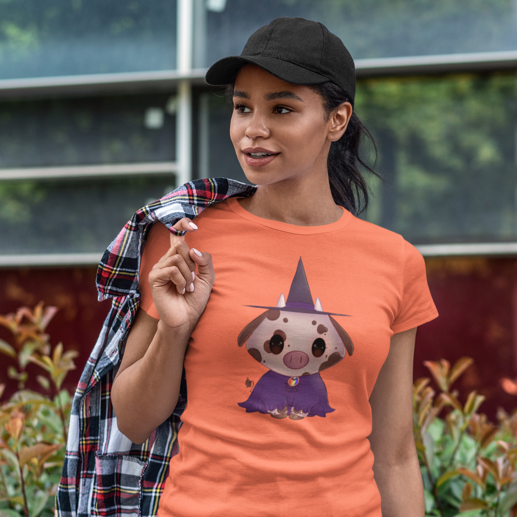 woman wearing a orange shirt with the bruff lingel cow design on it.