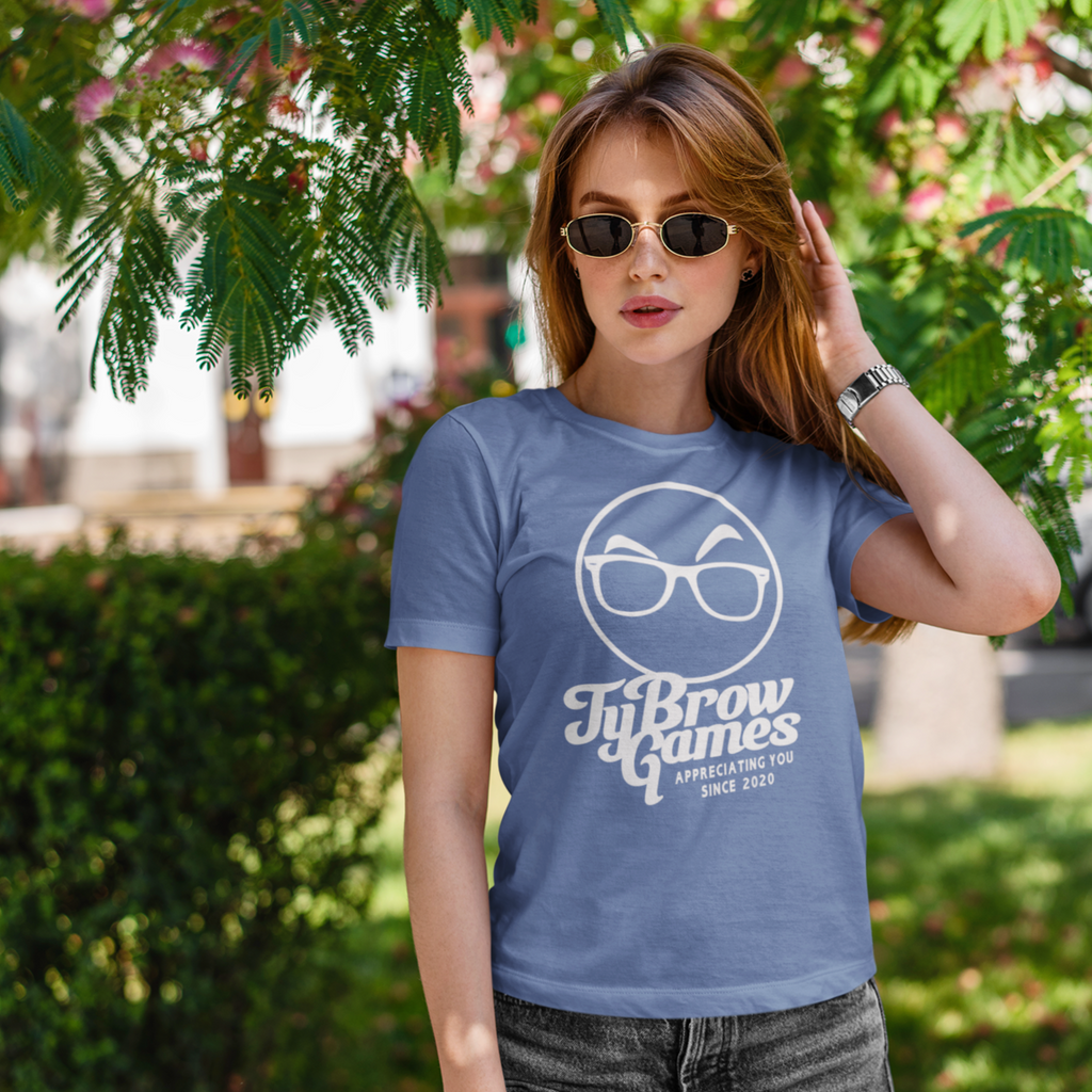 A woman in the park wearing sunglasses and a heather true royal tshirt with the TyBrowGames script design.