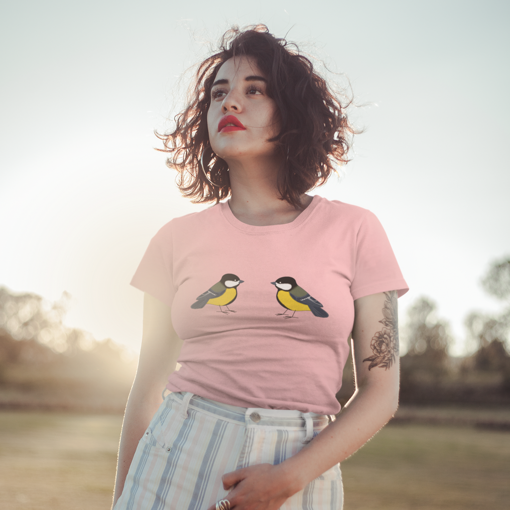 woman standing in a field with a pink great tits tshirt from Brooklynne Michelle