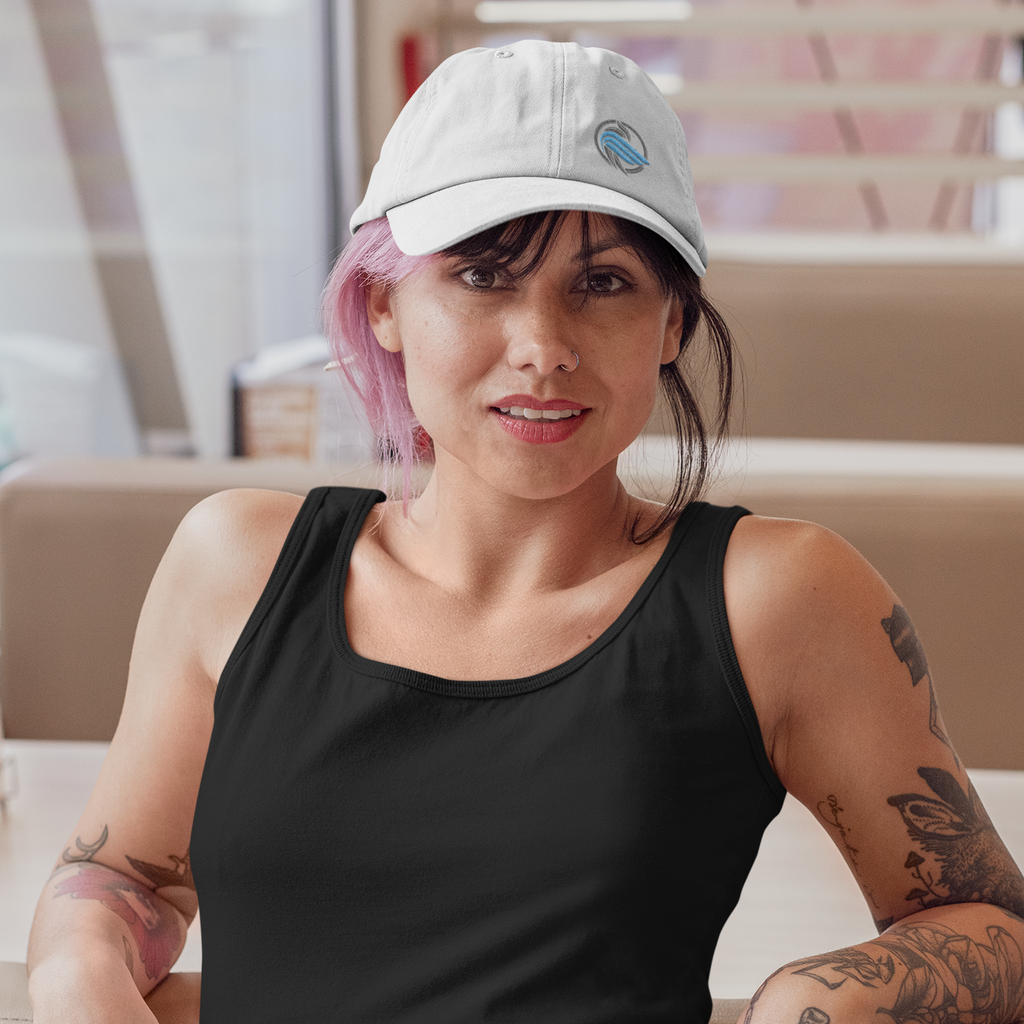 a woman in a diner wearing a black tank top and a white dad hat with the sparrow coin embroidered design from aBlackSparrow