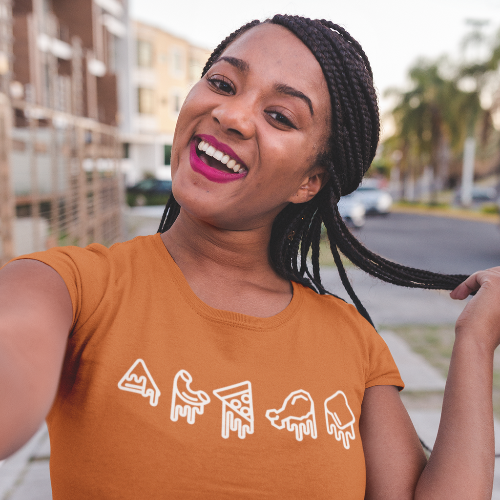 a woman taking a selfie wearing an orange tshirt with the melted food design from ZachNCheese