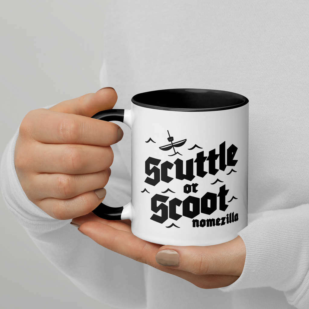Person holding black and white mug with Scuttle or Scoot design