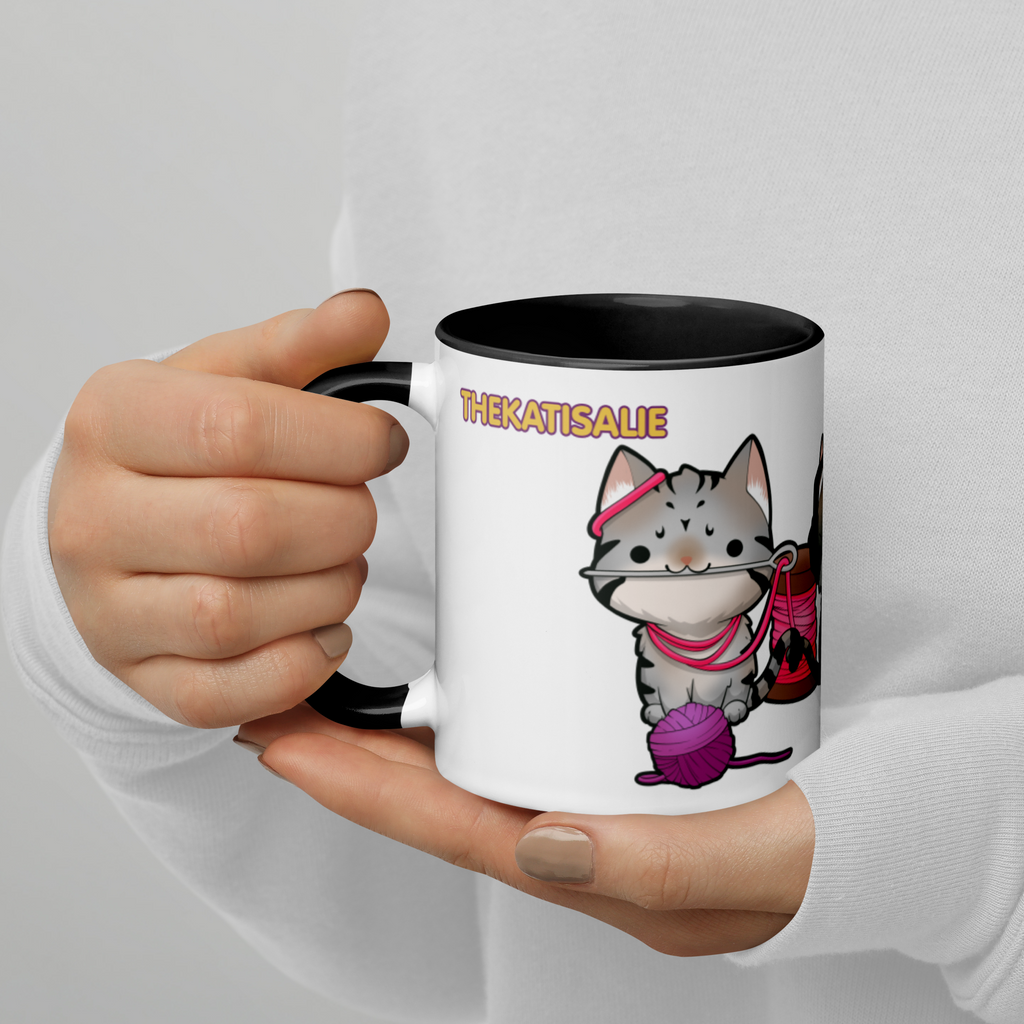 Person holding black and white mug with thekatisalie Cat Trios design