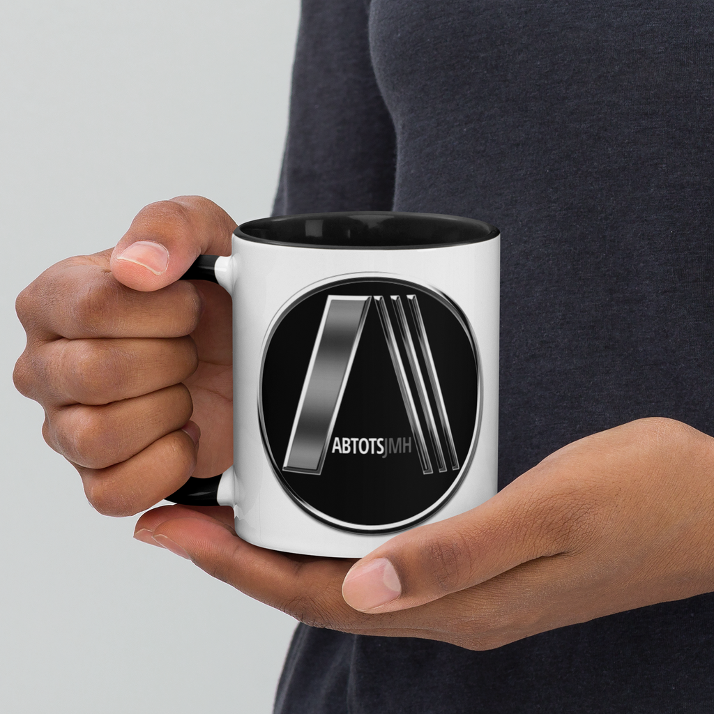Person holding black/white 11oz mug with logo design