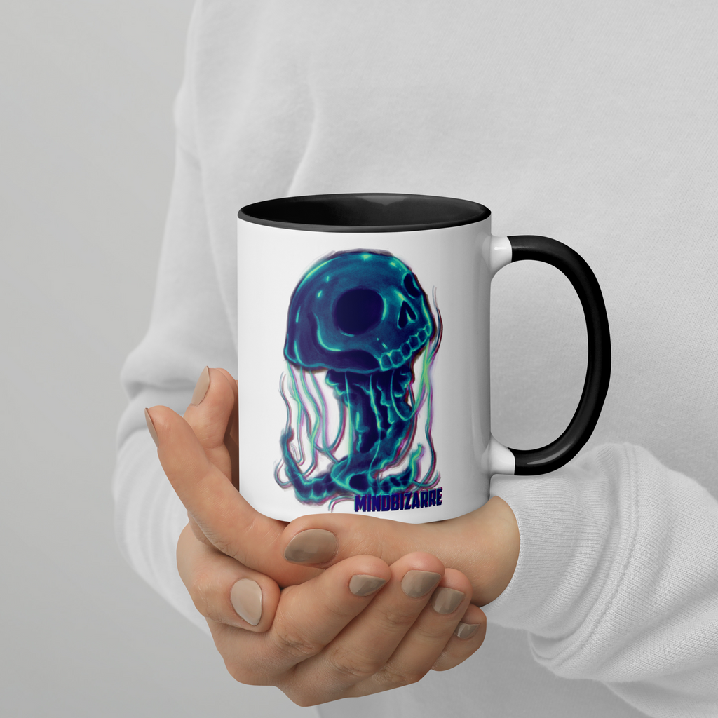Person holding black/white mug with jellyfish design
