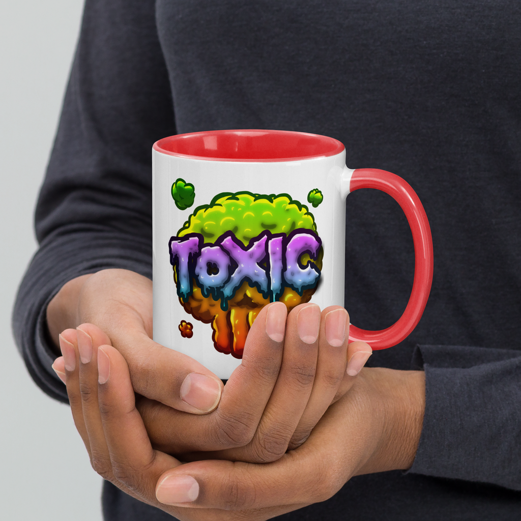 Person holding red/white mug with Toxic design