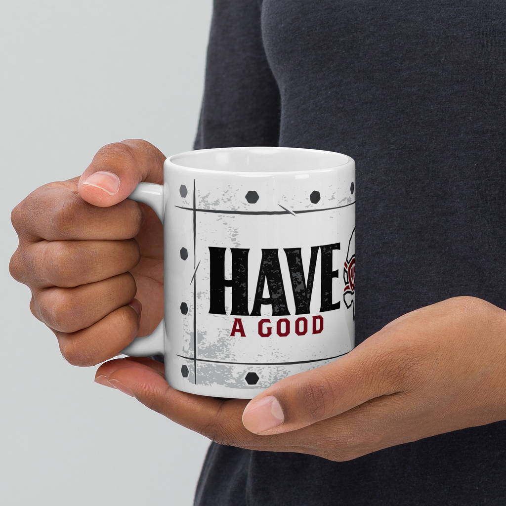 Person holding 11oz mug with Have a Good design